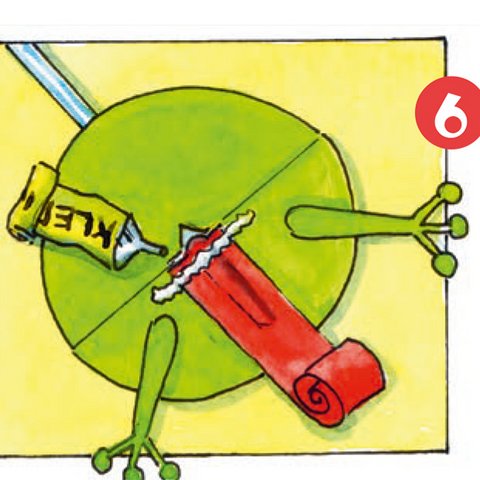 Aufgeklappter grüner Papier-Frosch-Kreis mit aufgerollter roter Zunge und Kleber