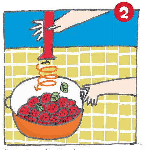 Erdbeeren in orangenem Topf mit Pürierstab mixen.