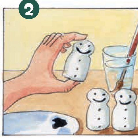 Korken als Schneemänner weiß bemalt.