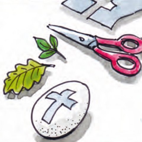 Ei mit ausgeschnittenem Papierkreuz, Schere und Blätter